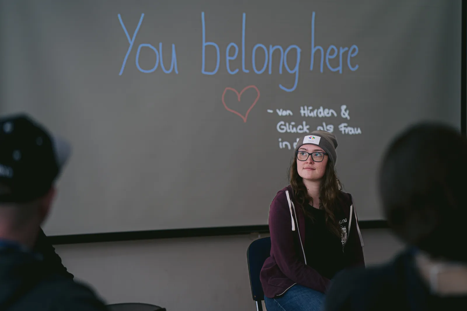 Me, sitting in front of one of my slides during a panel discussion